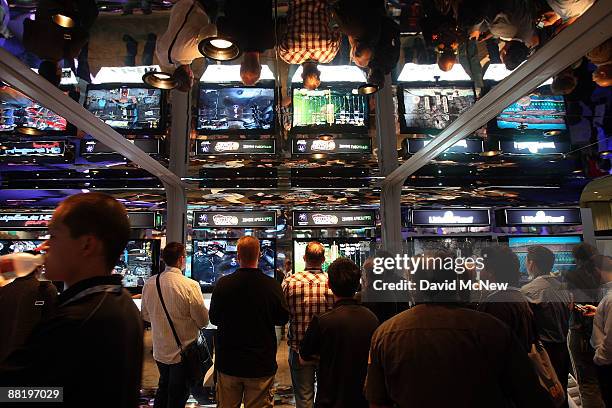 Showgoers try out games at the PlayStation exhibit at the 2009 E3 Expo on June 3, 2009 in Los Angeles, California. The 2009 E3 Expo features over 200...