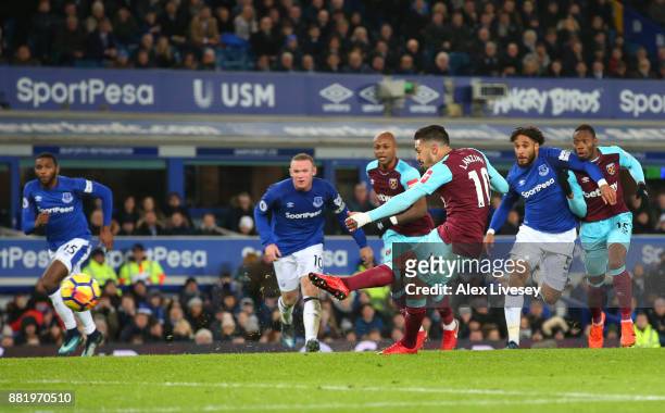 Manuel Lanzini of West Ham United takes a penalty that is saved by Jordan Pickford of Everton during the Premier League match between Everton and...