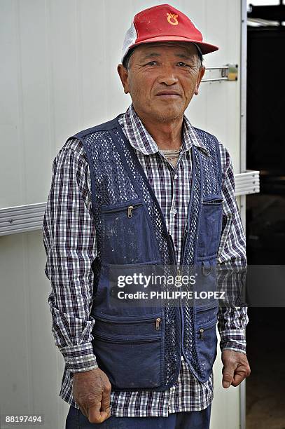 NKorea-nuclear-weapons-SKorea-border,FOCUS by Daniel Rook Rice and ginseng farmer Cho Suk-Haan poses in Tongilchon, just south of the Demilitarised...