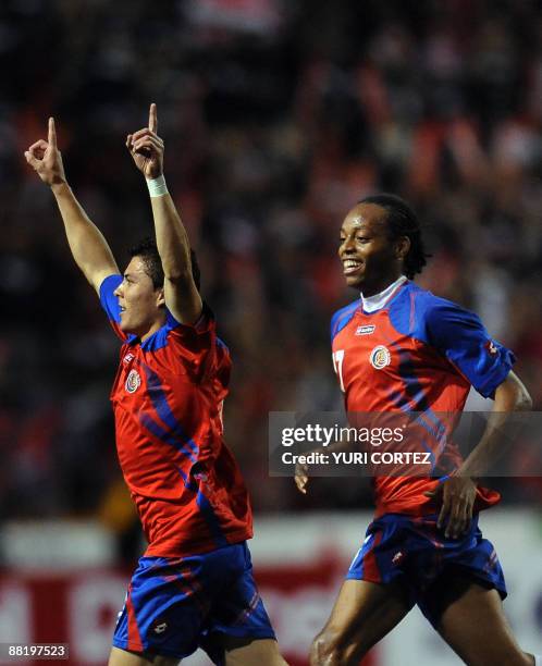 Costa Rican Pablo Herrera and Junior Diaz celebrate after scoring against the US during their FIFA World Cup South Africa-2010 qualifier match on...
