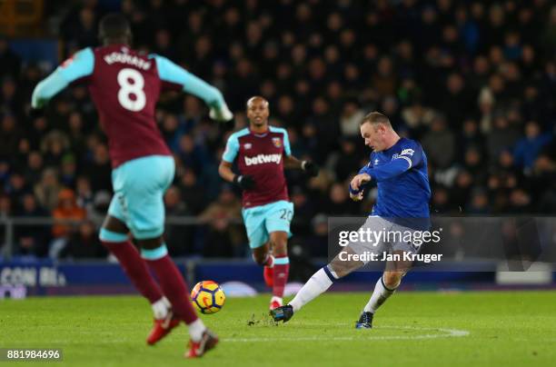 Wayne Rooney of Everton scores his sides third goal during the Premier League match between Everton and West Ham United at Goodison Park on November...