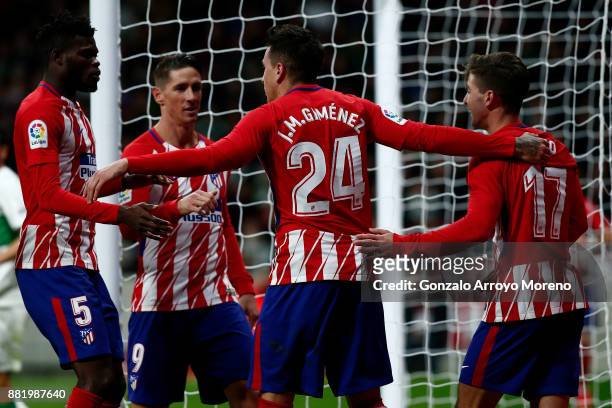 Jose Maria Gimenez of Atletico de Madrid celebrates scoring their opening goal with teammates Thomas Teye Partey , Fernando Torres and Luciano Vietto...