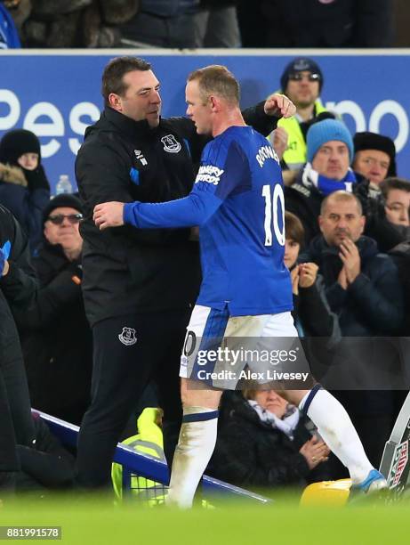 David Unsworth, Caretaker Manager of Everton and Wayne Rooney of Everton embrace during the Premier League match between Everton and West Ham United...