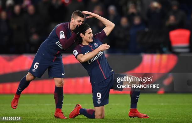 Paris Saint-Germain's Uruguayan forward Edinson Cavani celebrates with Paris Saint-Germain's Italian midfielder Marco Verratti after scoring a goal...