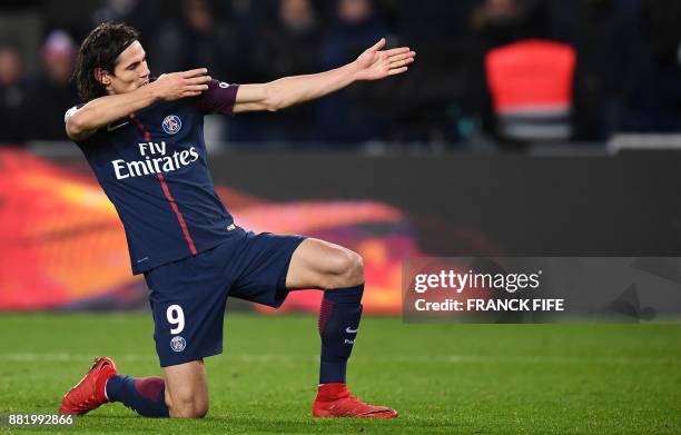 Paris Saint-Germain's Uruguayan forward Edinson Cavani celebrates after scoring a goal during the French L1 football match between Paris...