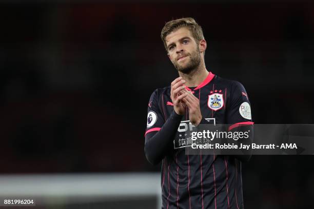 Martin Cranie of Huddersfield Town applauds the fans at full time during the Premier League match between Arsenal and Huddersfield Town at Emirates...