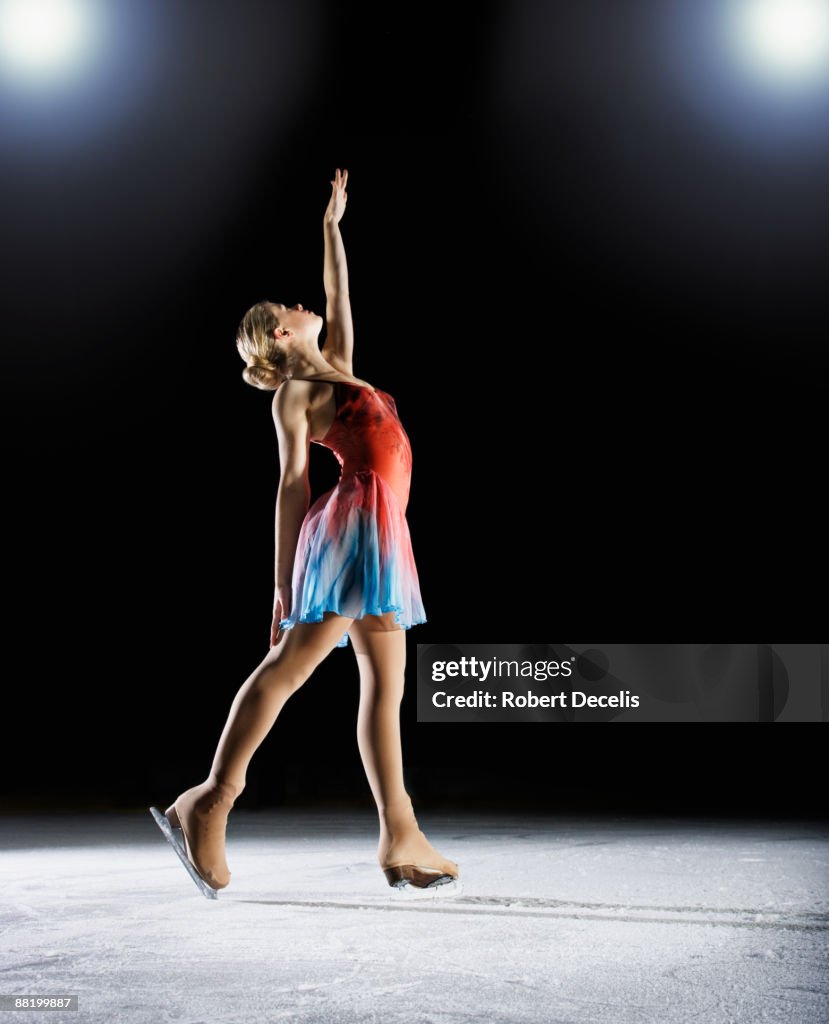 Female figure skater, about to start performance.