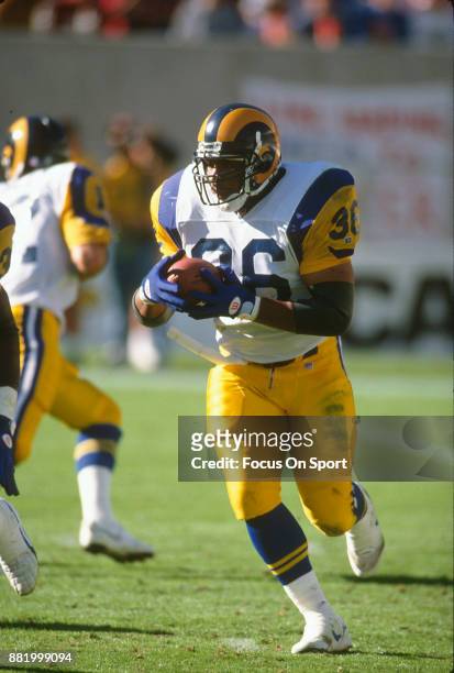Jerome Bettis of the Los Angeles Rams carries the ball against the Tampa Bay Buccaneers during an NFL football game December 11, 1993 at Tampa...
