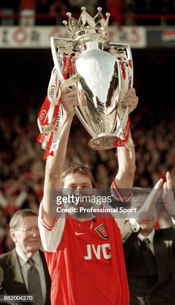Arsenal captain Tony Adams lifts the FA Carling Premiership trophy after the final home game of the season against Everton at Highbury on May 03,...