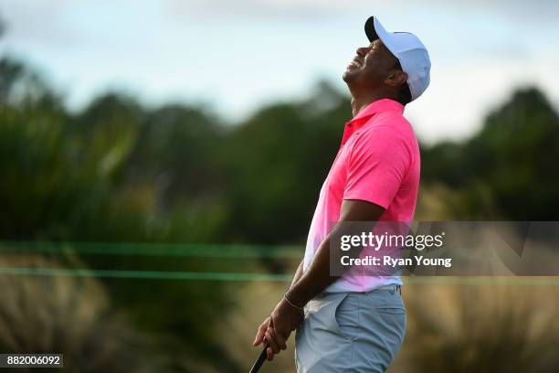 Tiger Woods laughs on the putting green during practice for the Hero World Challenge at Albany course on November 29, 2017 in Nassau, Bahamas.