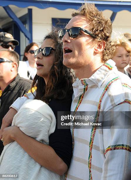Actor Matthew McConaughey with girlfriend Camila Alves and son Levi appear at the MaliBLUE Music & Art Festival Surfrider Foundation Benefit on the...
