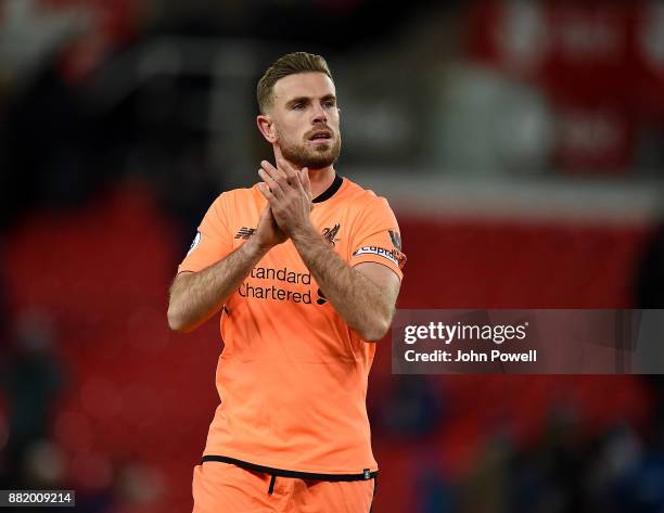 Jordan Henderson of Liverpool shows his appreciation to the fans at the end of the Premier League match between Stoke City and Liverpool at Bet365...