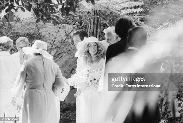 American actress Farrah Fawcett is escorted by her father James Fawcett , at her wedding to actor Lee Majors at the Hotel Bel-Air, Los Angeles,...