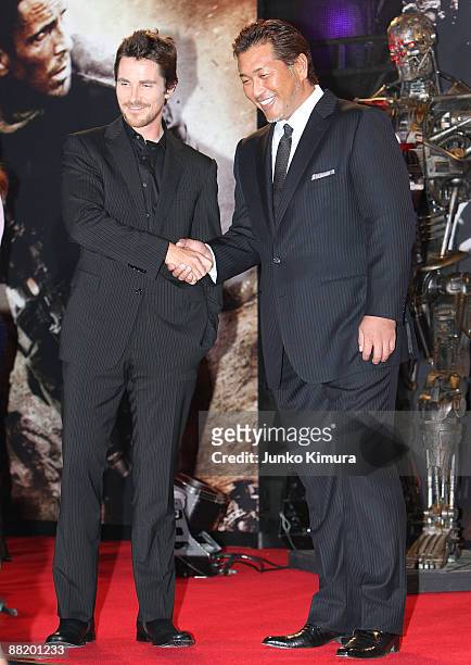 Actror Christian Bale and former Japanese baseball player Kazuhiro Kiyohara shakes hands during the Japan Premiere of "Terminator Salvation" at...