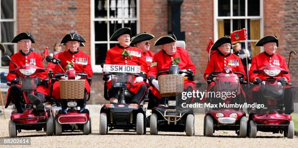 Chelsea Pensioners in their mobility scooters attend the annual Founders Day Parade at Royal Hospital Chelsea on June 4, 2009 in London, England.