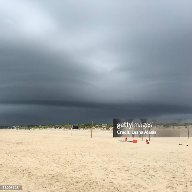 stormy sky above beach - leana alagia stockfoto's en -beelden