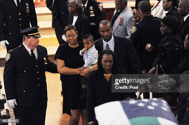 Danielle Edwards stands during the funeral for her husband New York Police officer Omar Edwards, who was killed in a friendly fire incident on May 28...