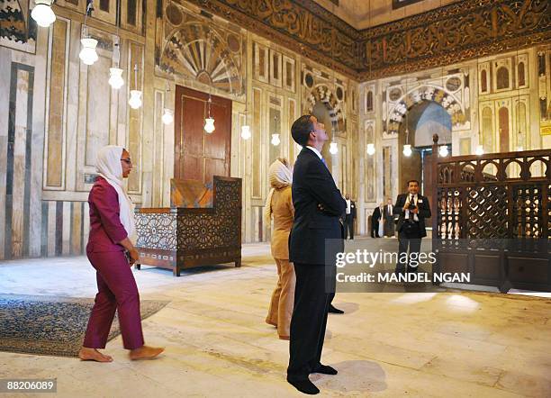 President Barack Obama and US Secretary of State Hillary Clinton tour the Sultan Hassan Mosque June 4, 2009 in Cairo. Built in 1256, the mosque is...