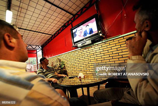 Macedonian Muslim people listen to US President Barack Obama's speech at Cairo University, at a tea shop in the village of Studenicani near capitol...