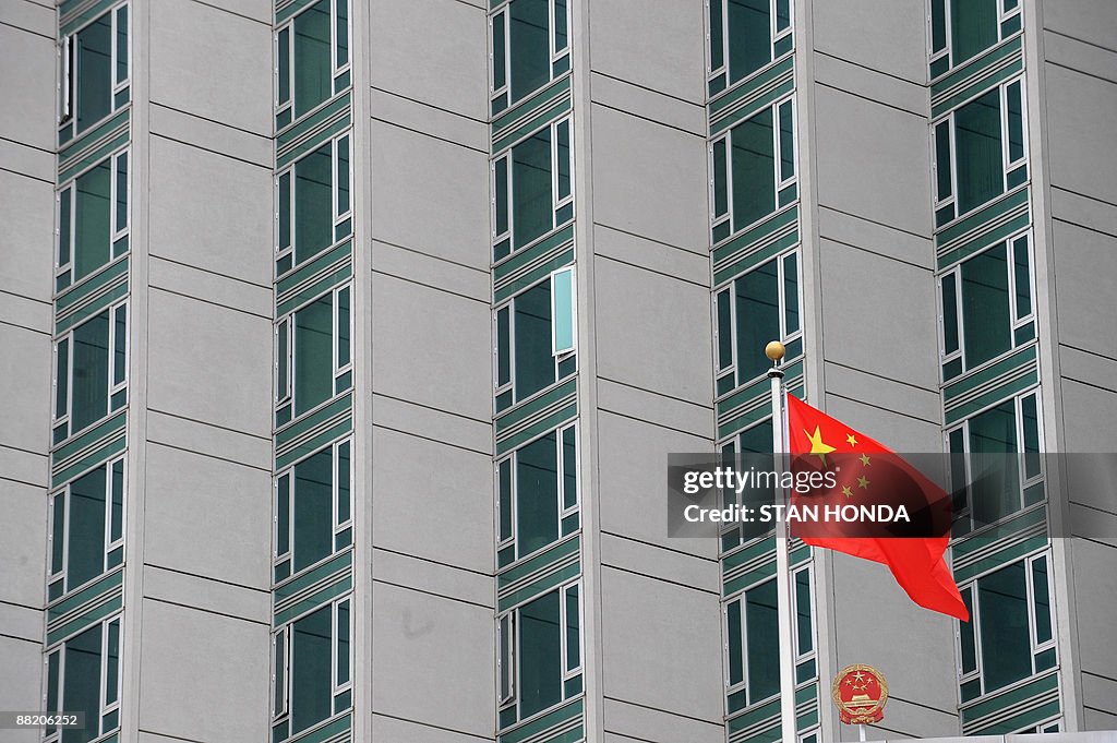 The Chinese flag flies outside the consu