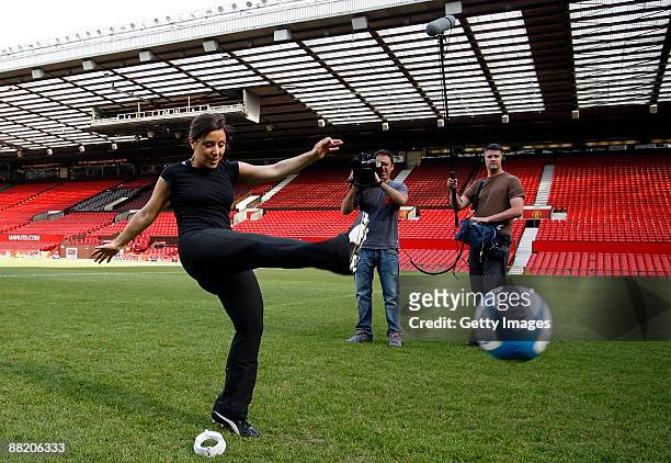 Gail Davis of Sky Sports News kicks for goal during a kicking clinic for media at Old Trafford on June 4, 2009 in Manchester, England.