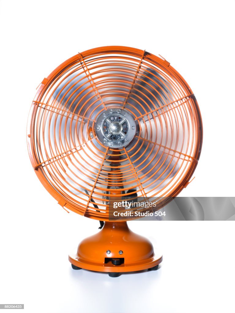 Orange Fan With Rotating Blades High-Res Stock Photo - Getty Images