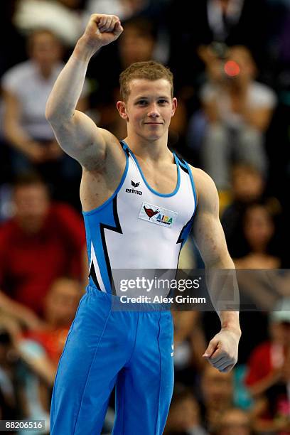 German gymnast Fabian Hambuechen celebrates during an award ceremony at the German individual championship during the German Gymnastics Festival at...