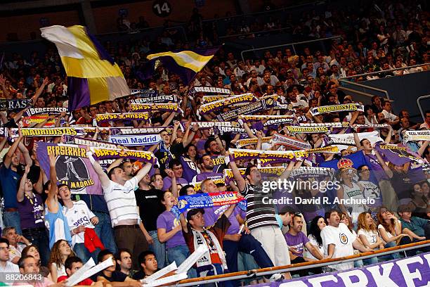 Real Madrid fans cheer for their team during the ACB Semi-final Game 2 match between Real Madrid and Tau Ceramica on June 4, 2009 in Madrid, Spain.