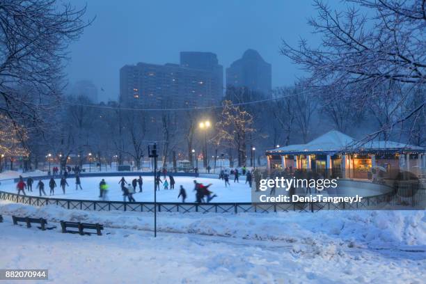 ice-skating on frog pond in the boston common - ice skating rink stock pictures, royalty-free photos & images