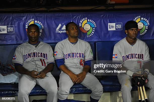 Dominican Republic players Jose Guillen, Damaso Marte, and Jose Reyes, soak in their upset loss to The Netherlands at the end of the game in the...