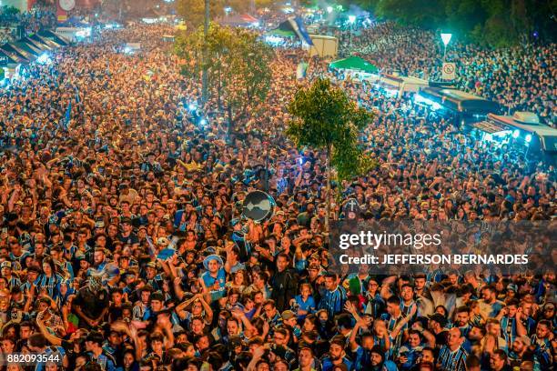 Fans of Brazil's Gremio watch their team during the 2017 Copa Libertadores game against Argentina's Lanus on the streets of Porto Alegre, Brazil, on...