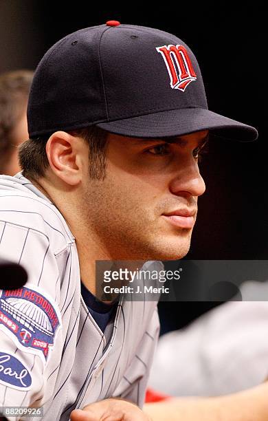 Catcher Joe Mauer of the Minnesota Twins watches his team against the Tampa Bay Rays during the game at Tropicana Field on May 31, 2009 in St....