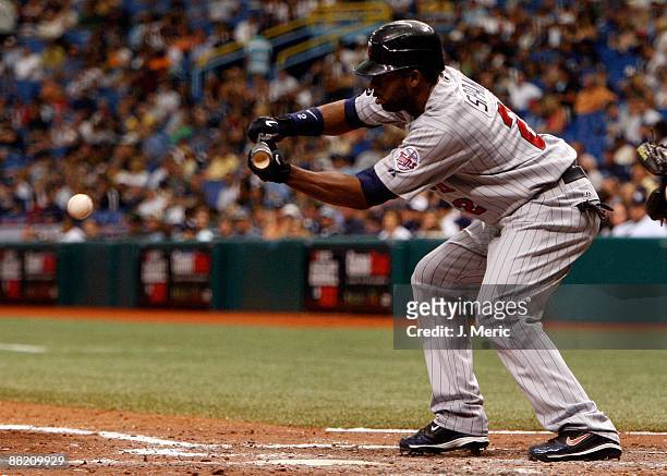 Outfielder Denard Span of the Minnesota Twins bunts against the Tampa Bay Rays during the game at Tropicana Field on May 31, 2009 in St. Petersburg,...