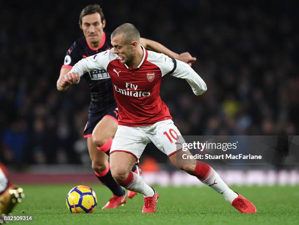 Jack Wilshere of Arsenal takes on Dean Whitehead of Huddersfield during the Premier League match between Arsenal and Huddersfield Town at Emirates...