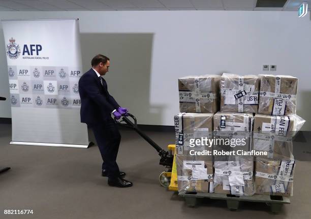 Representative from the Victorian Joint Organised Crime Taskforce wheels in 300kg of cocaine at the Australian Federal Police Melbourne office on...