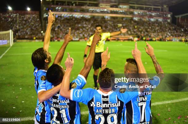 Fernandinho of Gremio and teammates celebrate the opening goal during the second leg match between Lanus and Gremio as part of Copa Bridgestone...