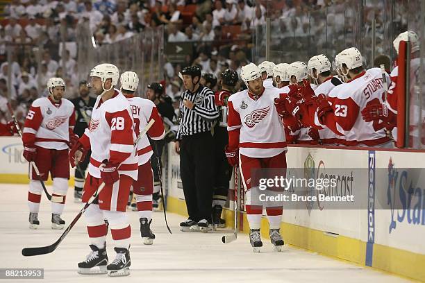 Brad Stuart of the Detroit Red Wings celebrates a goal against the Pittsburgh Penguins during Game Three of the 2009 NHL Stanley Cup Finals on June...