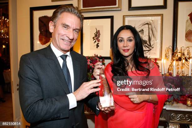 World sales at Danone Waters, Laurent Cintrat and HRH Princess Diya Kumari of Jaipur pose with the "Evian Water Bottle : Princess Diya Kumari of...