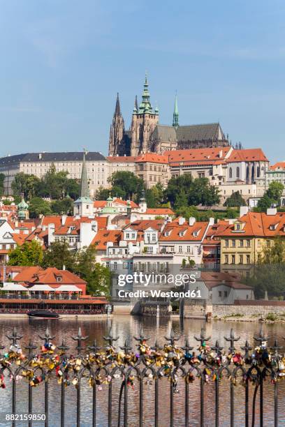 czech republic, prague, hradcany, vltlava and love locks on charles bridge - prague castle stock pictures, royalty-free photos & images