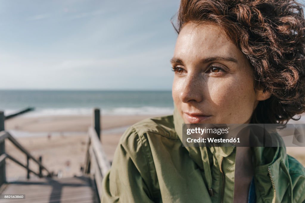 Portrait of woman on boardwalk at the beach