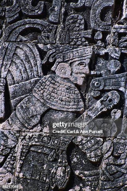 detail showing figure from sculptural program at chichen-itza - ann purcell stockfoto's en -beelden