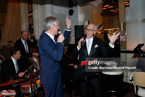 Journalist Jean-Claude Narcy and Director of the "Le Relais Plaza" Restaurant Werner Kuchler sing during "The Swing in Relais Evening" at "Le Relais...