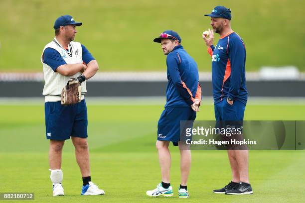 To R, Batting coach Craig McMillan, coach Mike Hesson and bowling coach Shane Jurgensen look on during a New Zealand Blackcaps training session at...