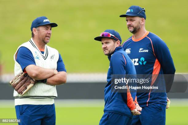 To R, Batting coach Craig McMillan, coach Mike Hesson and bowling coach Shane Jurgensen look on during a New Zealand Blackcaps training session at...