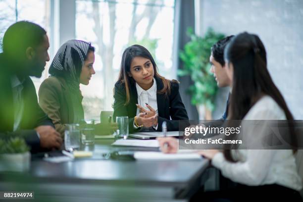 formal business meeting - muslim women in the workplace stock pictures, royalty-free photos & images
