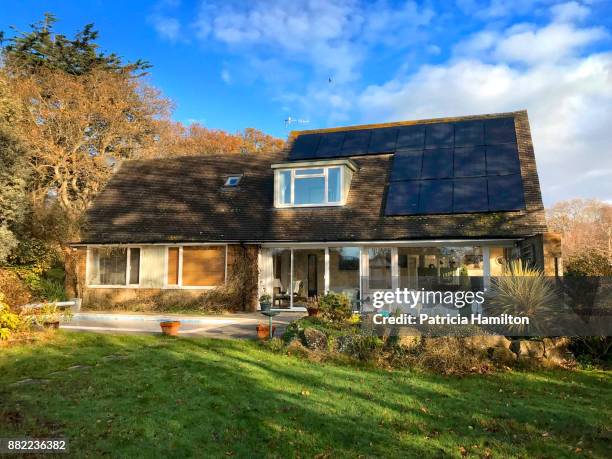 house exterior with solar panels - detached stock pictures, royalty-free photos & images