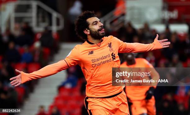 Mohamed Salah of Liverpool celebrates after scoring a goal to make it 0-3 during the Premier League match between Stoke City and Liverpool at Bet365...