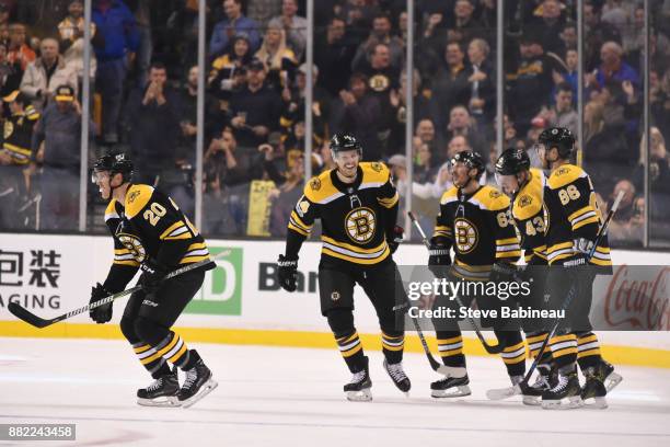 The Boston Bruins celebrate a goal in the second period against the Tampa Bay Lightning at the TD Garden on November 29, 2017 in Boston,...