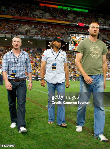 Australian cricketers Brad Haddin, Andrew Symonds, and Stuart Clark attend the 2008 Rugby League World Cup Final match between the Australian...