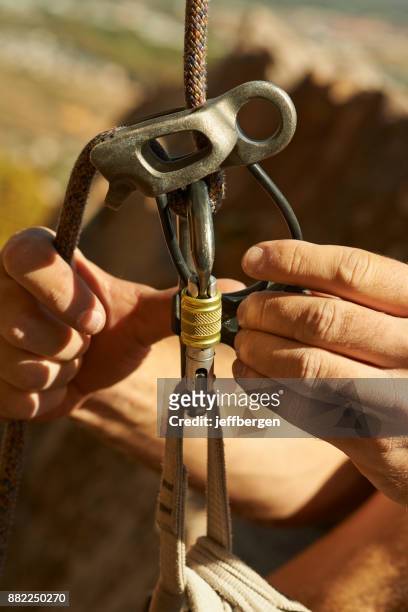 safety checks are crucial for a rock climber - pulley stock pictures, royalty-free photos & images
